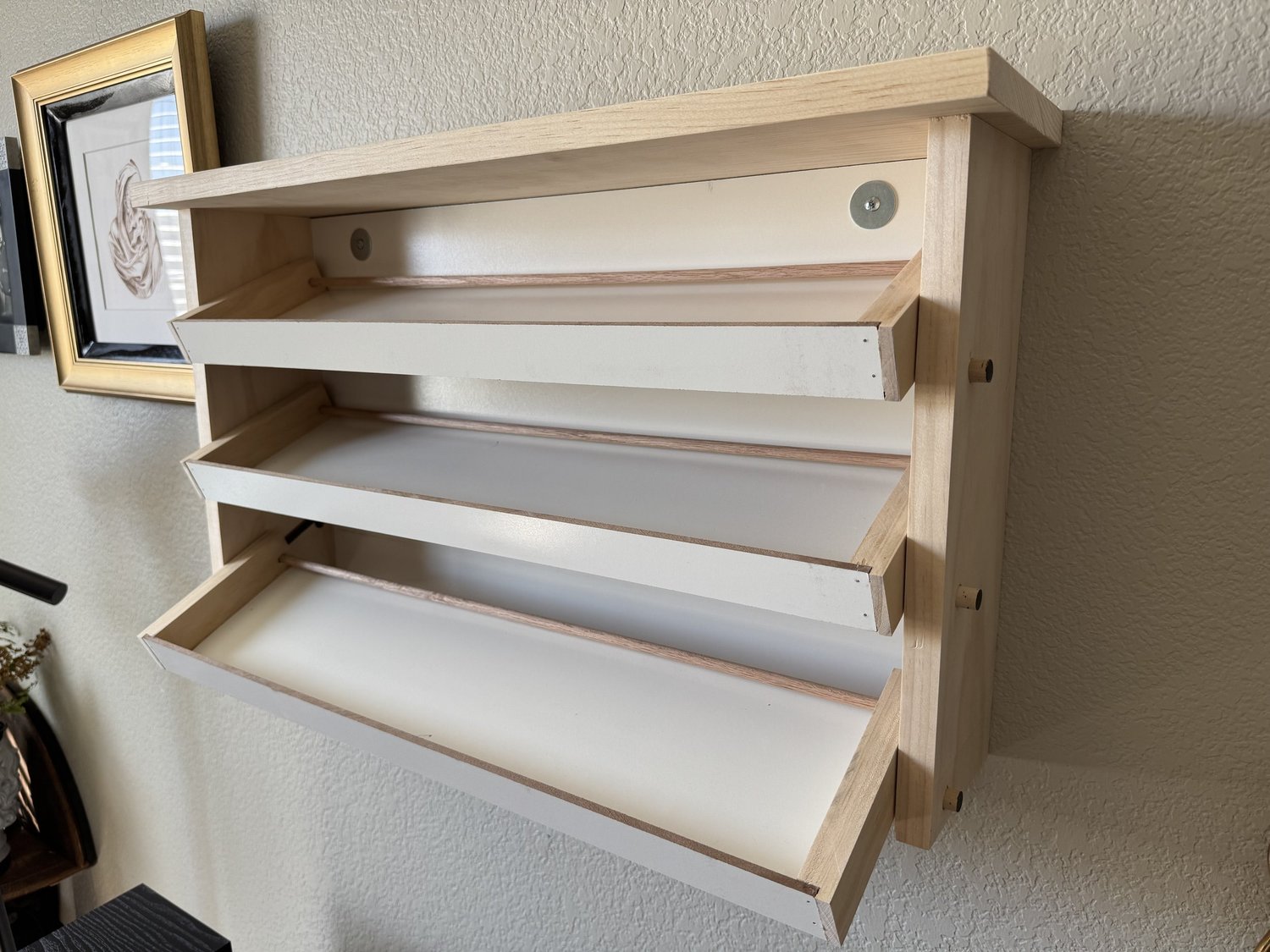 Finished cassette shelf viewed from the side with all three rows extended