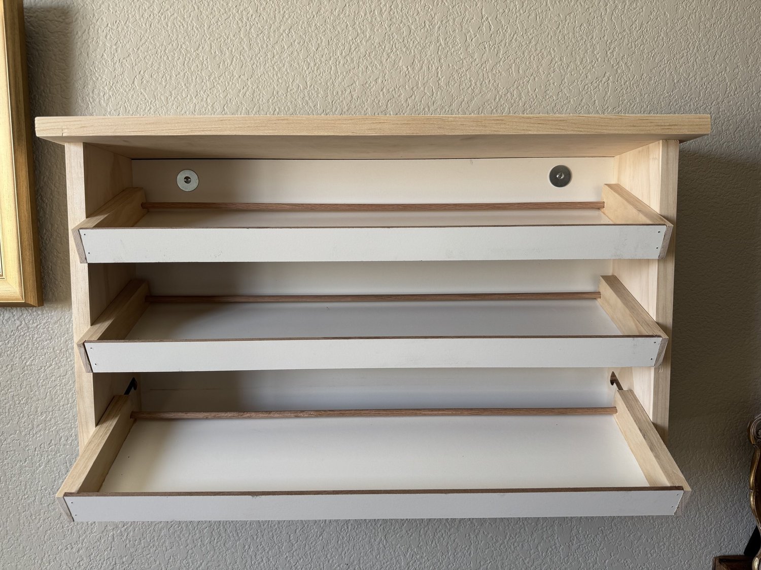 Cassette shelf with all three pull-out rows extended and tilted down