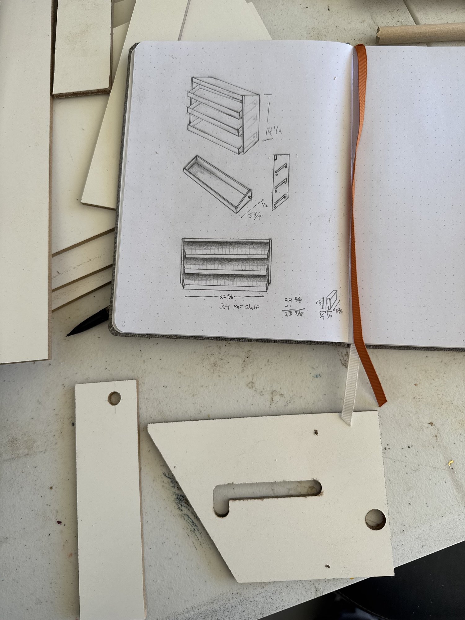 Initial cassette shelf sketches beside the router template for the L-shaped track